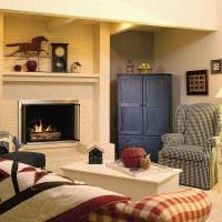 مثال على ديكور جميل لغرفة المعيشة مع صورة مدفأة