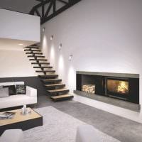 مثال على تصميم داخلي جميل لغرفة المعيشة مع صورة مدفأة
