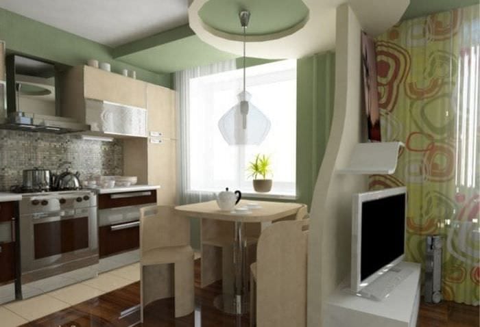 Liten multifunksjonell kjøkken-stue med innebygde hvitevarer