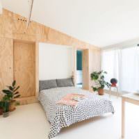 Dřevo v interiéru spací části jedné místnosti