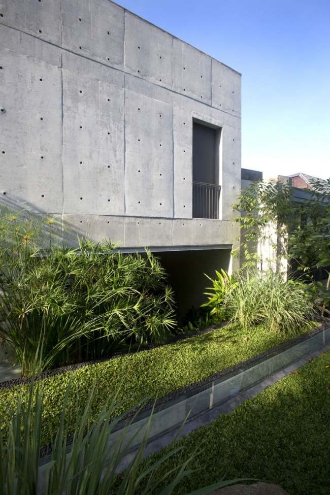 moderne flerfamiliehus armeret beton facade chang arkitekter landskabspleje