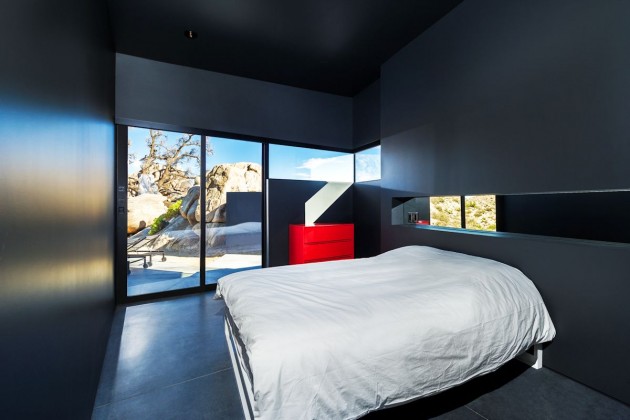 moderne sort hus lille soveværelse rød kommode