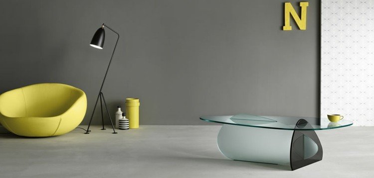 glasbord design moderne-sort-gennemsigtig-oval-lænestol-gul-gulvlampe