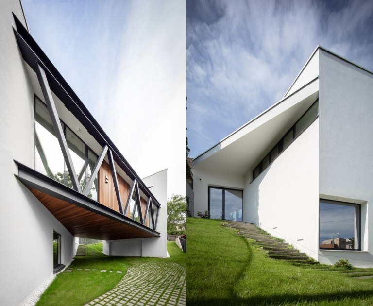 Enfamiliehus med hvid facade og trædetaljer moderne arkitektur