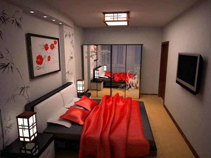 כיסוי מיטה אדום בחדר שינה עם קירות אפורים
