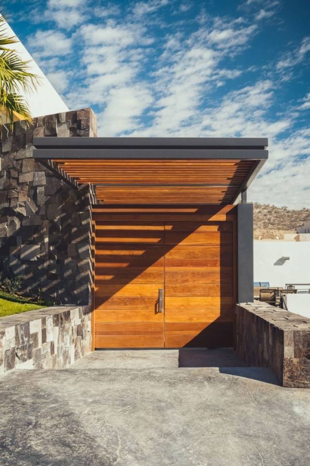 Moderne-by-villa-indgang-med tagdækning-træ-sten-Residencia-R35