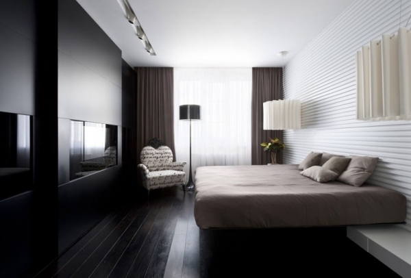 moderne lejlighed soveværelse sort mat pejs beige seng