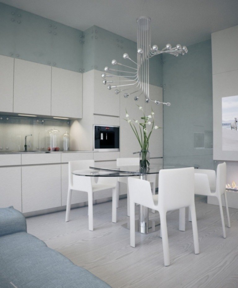 Åbent køkken med stue -små-hvid-højglans-moderne-stole-bord-glas-top-lys-moderne-ekstravagant