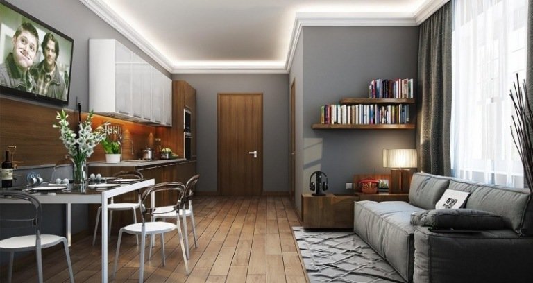 åbent-køkken-stue-grå-træ-sofa-spisebord-indbygget køkken-væg hylde-lille