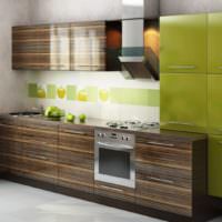 Kombinationen av bruna och olivfärger på köksuppsättningens fasader