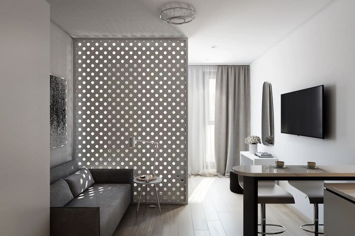 Huoneistosuunnittelu = studio, jossa on yksi ikkuna minimalismin tyyliin