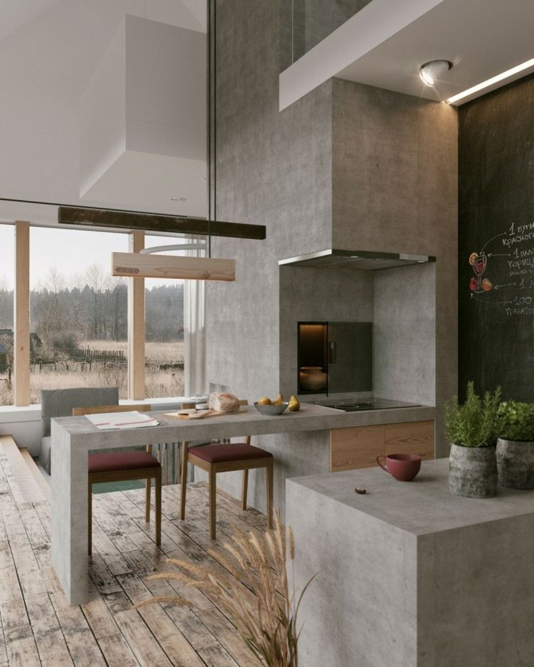 Lille køkken i betonlook og med væg i tavelfarve