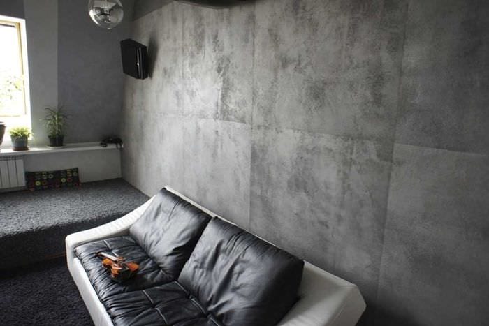 ajatus epätavallisesta koristekipsistä makuuhuoneen sisätiloissa betonin alla